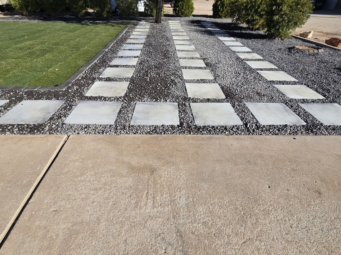 Square concrete stepping pads set in gray gravel