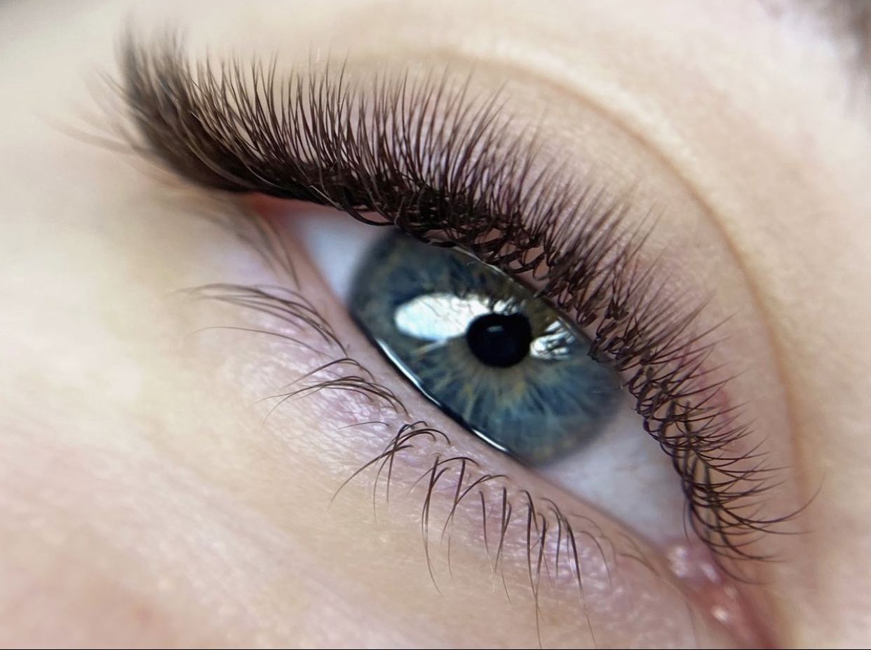 Extreme close-up of an eye with a full set of lash extensions