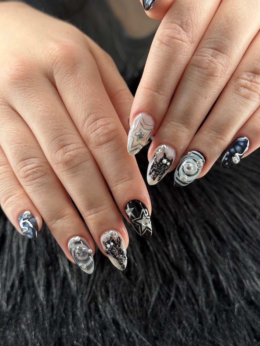 Nude almond nails with black and white swirl art