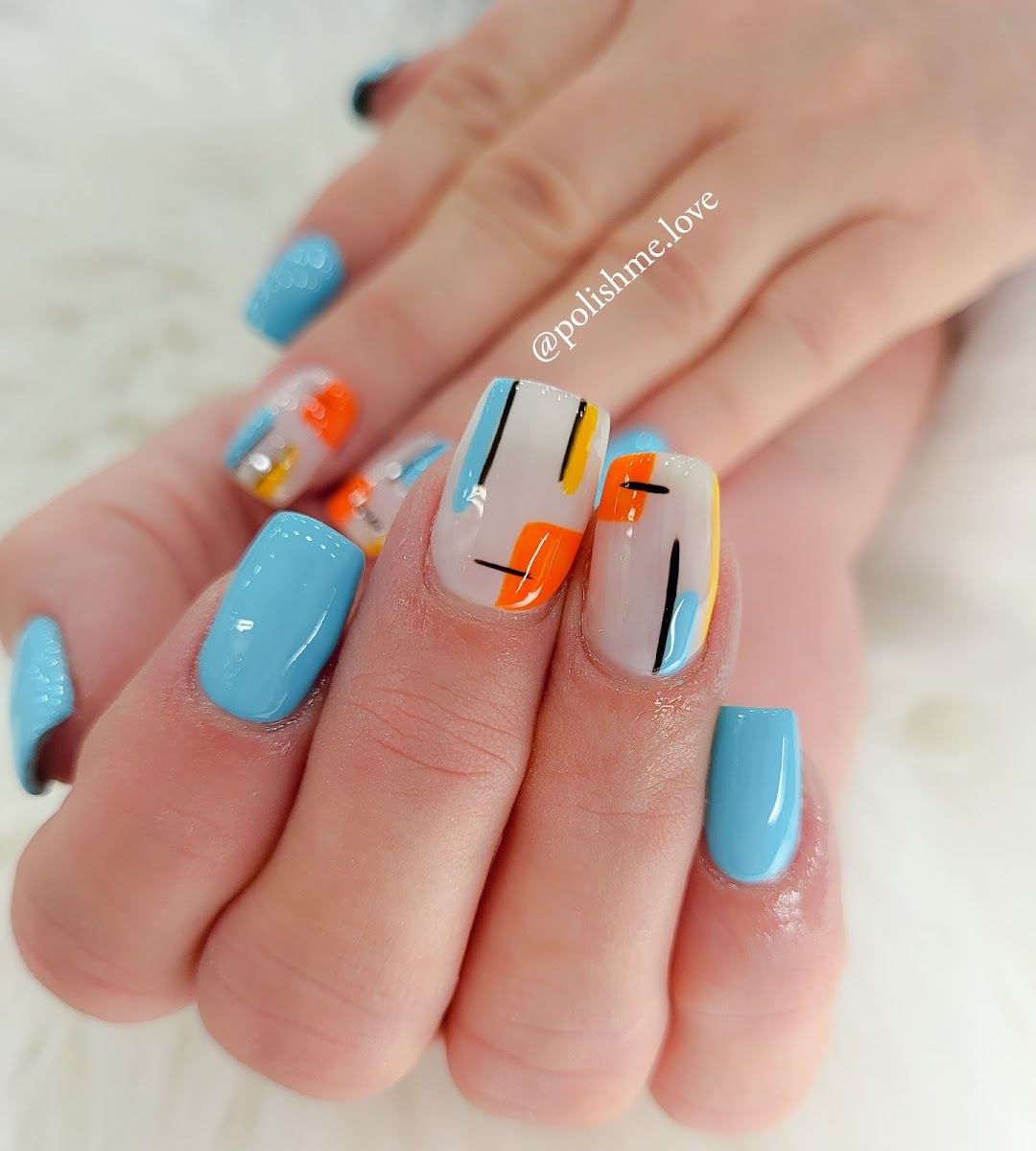 Sky blue square nails with bold abstract art