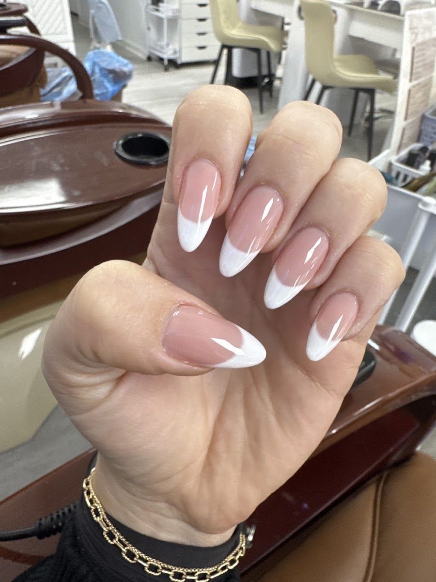A clean, skinny French tip set on almond nails