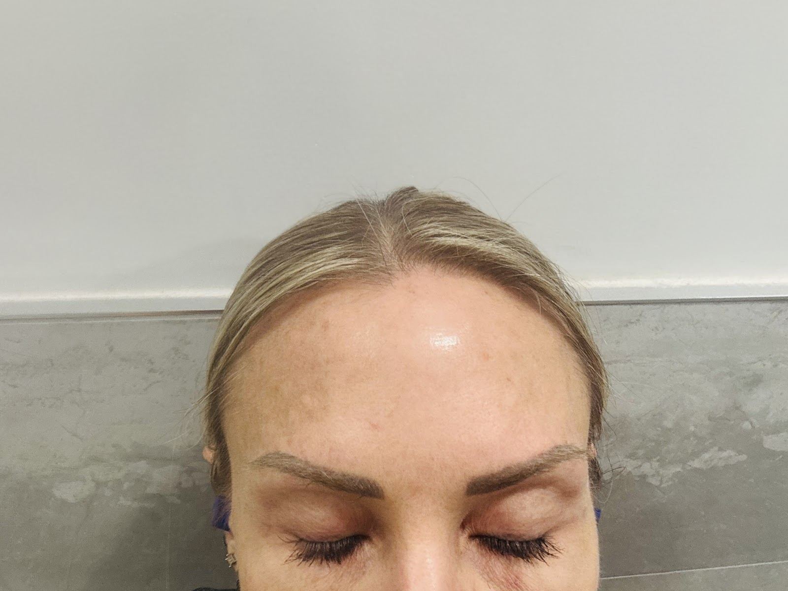 Client with freshly threaded, softly shaped eyebrows