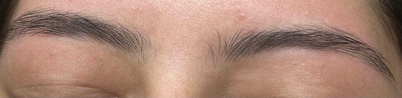 Close up of soft, tidy brows after threading