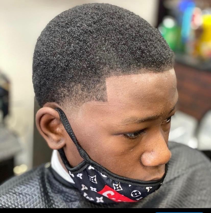 Close up of a young client's short cut with a crisp line up
