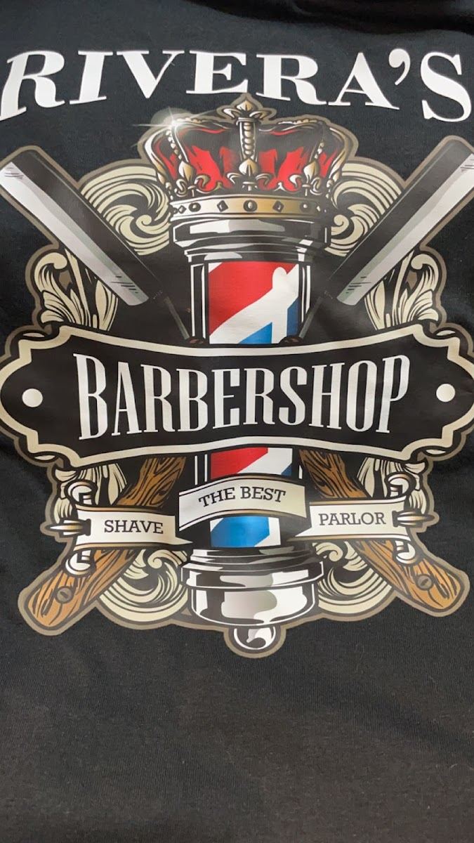 Rivera's Barbershop crest with a crown and barber pole printed on a black shirt