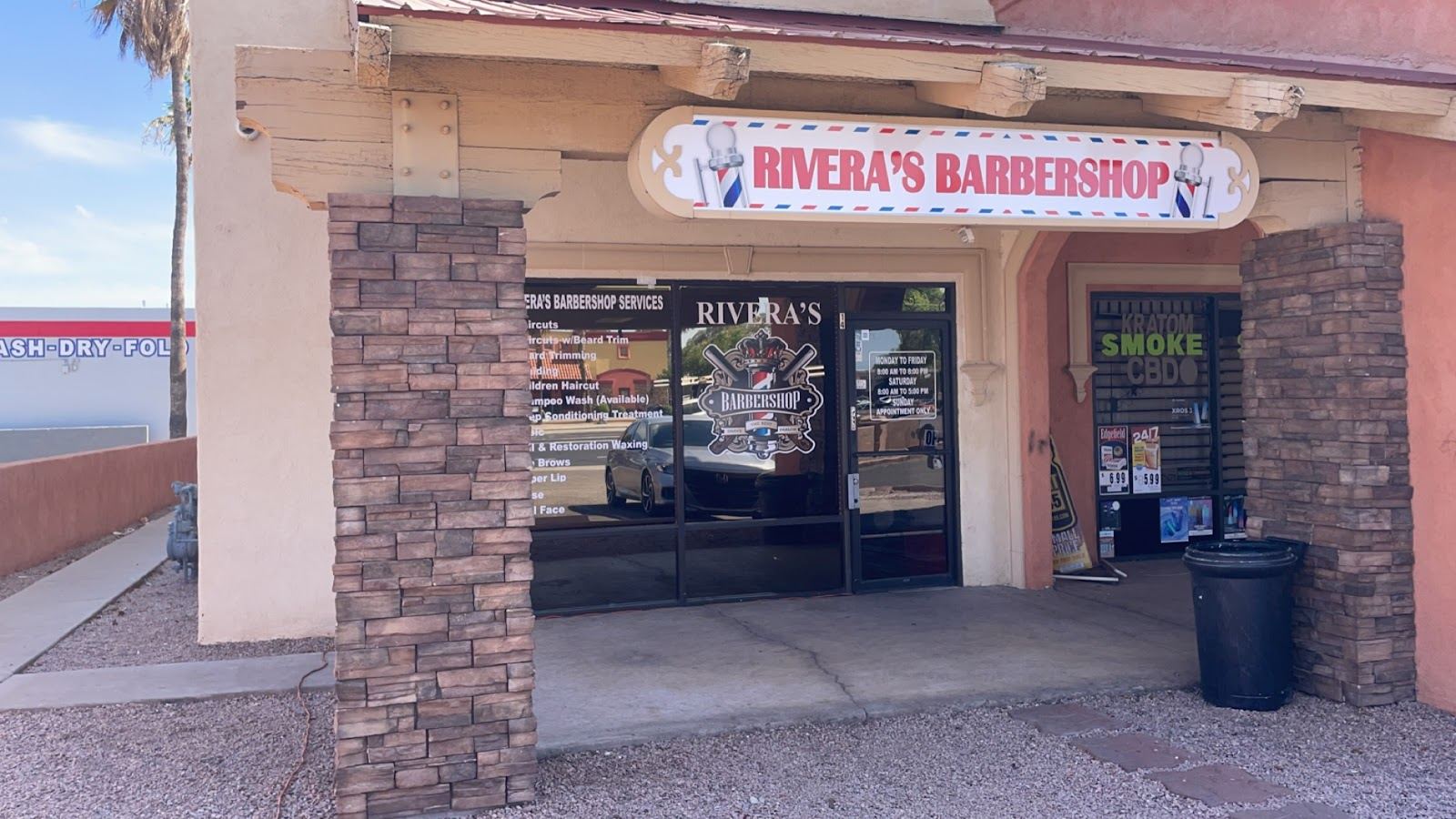 Rivera's Barbershop storefront on E University Dr with its red and white sign