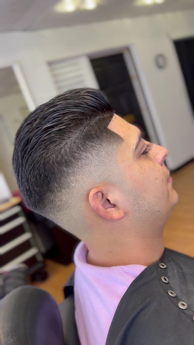Side view of a fade with a swept back pompadour