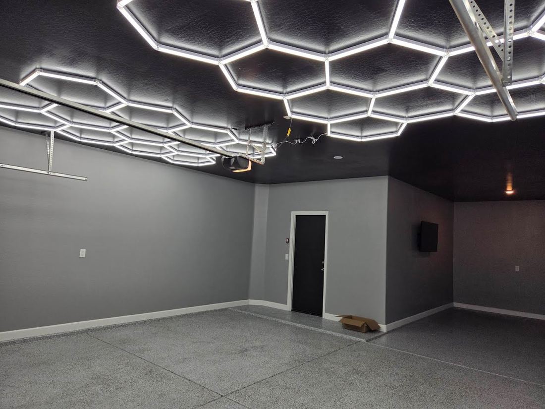 Garage with a honeycomb pattern of hexagon LED lights across the ceiling