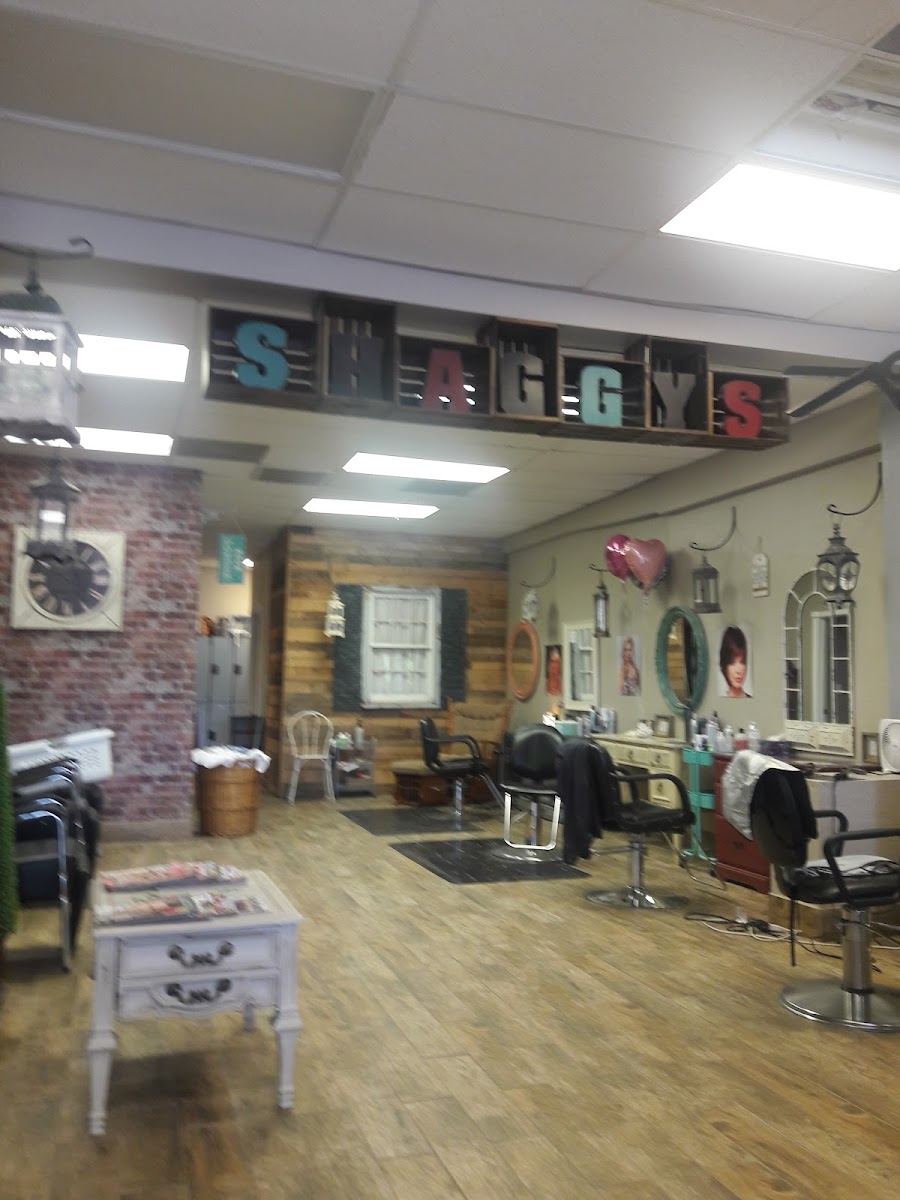 Inside Shaggy's: crate letter sign, brick wall, barnwood, lanterns and styling chairs