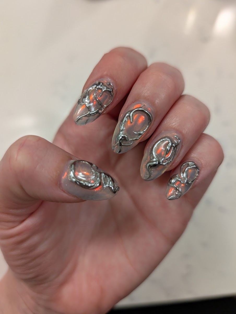 Clear almond nails with raised 3D chrome swirl art