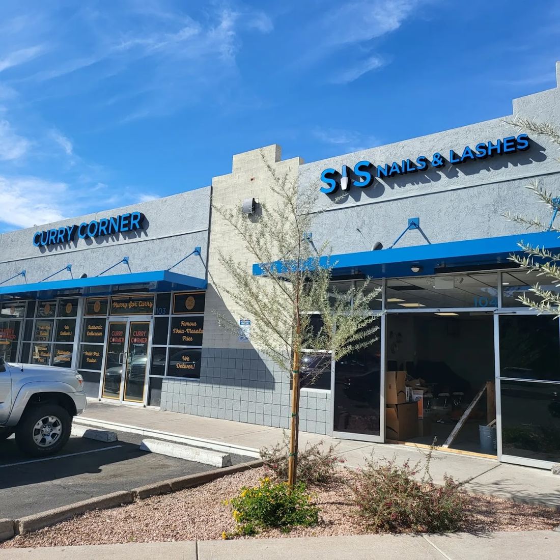 SIS Nails & Lashes storefront with blue signage in a Tempe shopping strip
