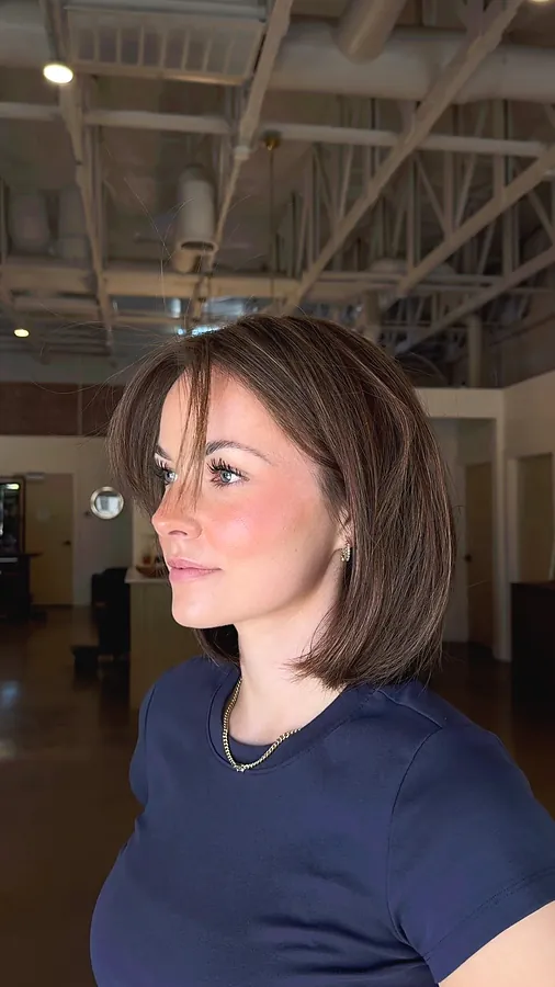 A chin length brunette bob with soft movement