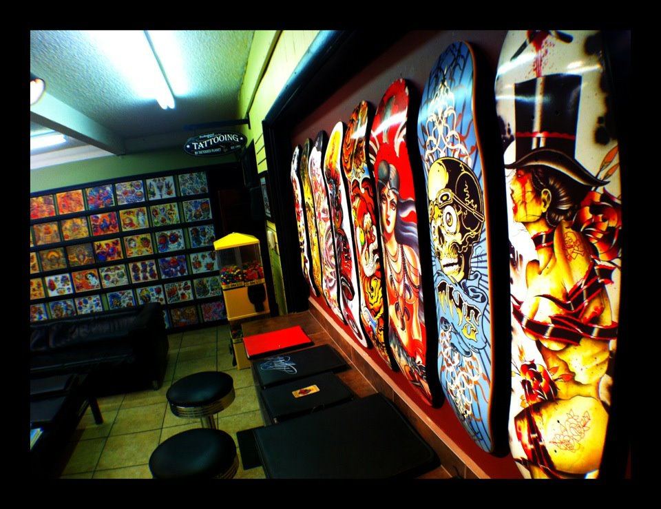Inside Tattooed Planet: flash art on the walls and painted skate decks