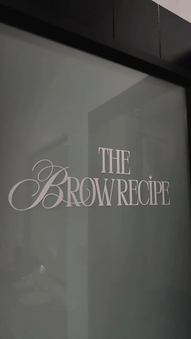 Frosted glass studio door printed with The Brow Recipe wordmark.