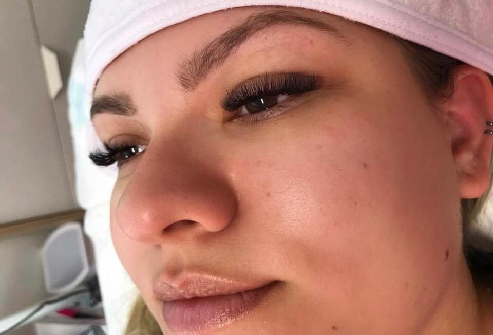 Client showing natural looking lash extensions