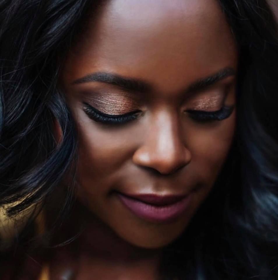Client with a soft lash look and glowing makeup