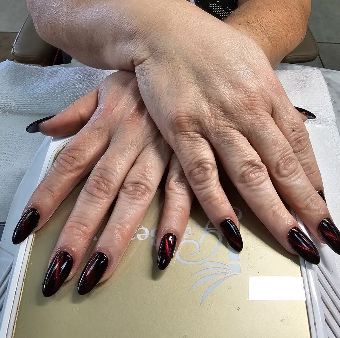 Long almond nails in deep burgundy cat-eye gel
