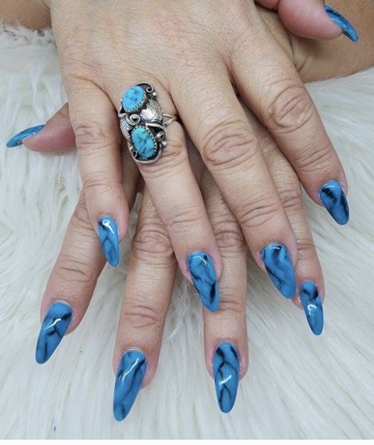 Long blue marbled almond nails