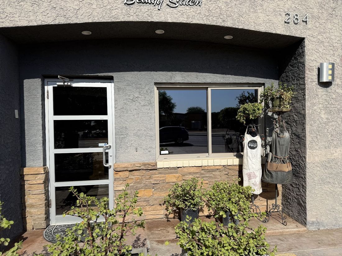 Front door and window of Win Salon at 284 S Dobson Rd