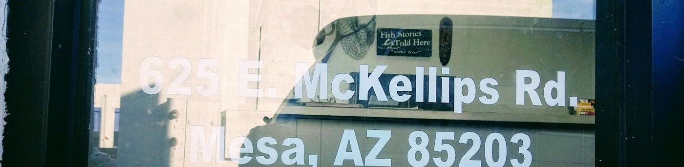 Shop window lettered 625 E McKellips Rd, Mesa, AZ 85203